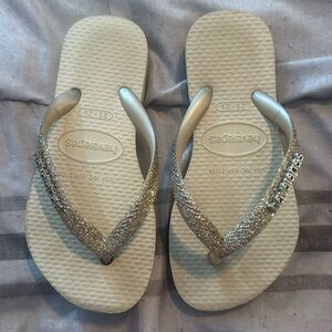 Little girl Havaianas gold sparkle flip flops. Worm one time.